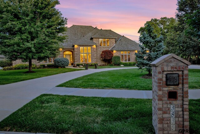 3835 S 179th Ter, Omaha, NE 68130 - french provincial home with a yard and stone siding
