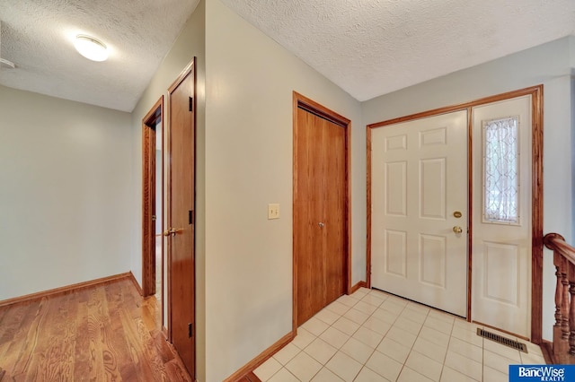 2727 N 75th St, Lincoln, NE 68507 - foyer with a textured ceiling and baseboards