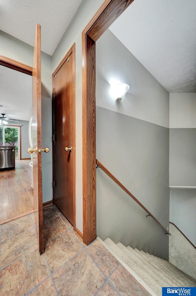 2727 N 75th St, Lincoln, NE 68507 - hallway with a textured ceiling and baseboards