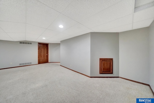2727 N 75th St, Lincoln, NE 68507 - finished basement featuring a paneled ceiling, carpet flooring, baseboards, and recessed lighting