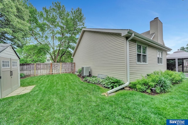 2727 N 75th St, Lincoln, NE 68507 - view of side of home featuring central air condition unit and a chimney