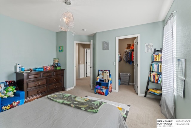 9002 N 156th Ave, Bennington, NE 68007 - bedroom featuring carpet floors, a walk in closet, baseboards, and a closet