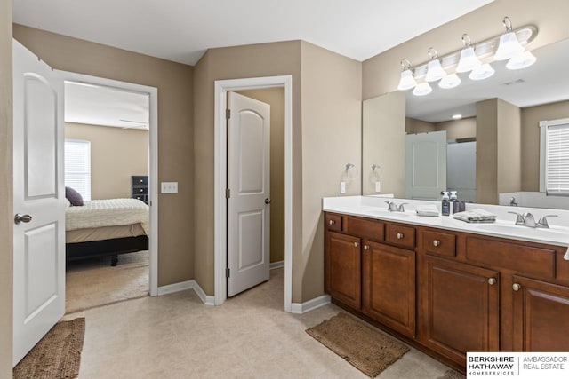 9002 N 156th Ave, Bennington, NE 68007 - ensuite bathroom with baseboards, tile patterned flooring, and double vanity