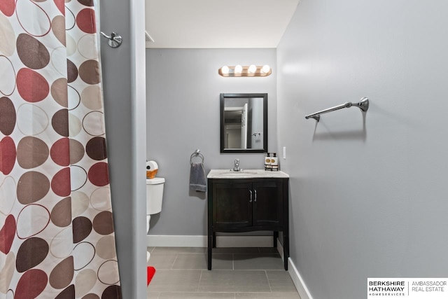 9002 N 156th Ave, Bennington, NE 68007 - full bath with tile patterned flooring, toilet, baseboards, vanity, and curtained shower