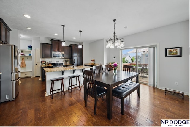 dining area with recessed lighting, a chandelier, and dark wood-type flooring