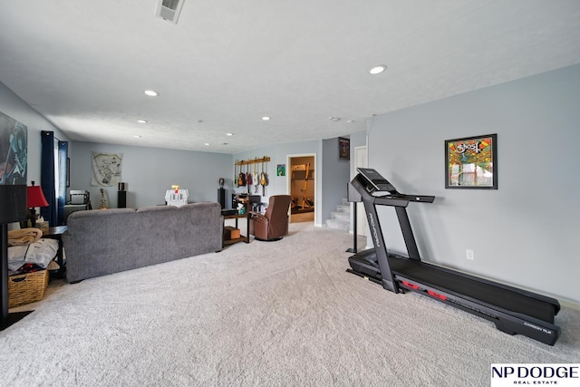 exercise area featuring light carpet and recessed lighting