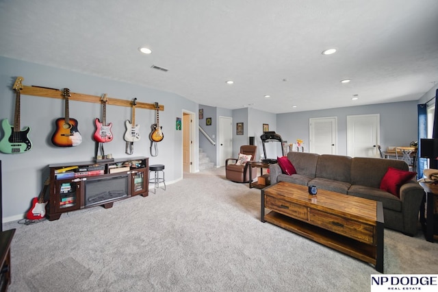 carpeted living area featuring stairs, recessed lighting, and baseboards
