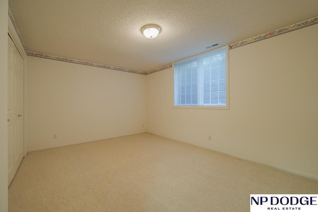 6630 Flint Ridge Rd, Lincoln, NE 68506 - empty room with a textured ceiling and carpet floors
