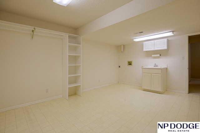 6630 Flint Ridge Rd, Lincoln, NE 68506 - finished basement with a sink and baseboards