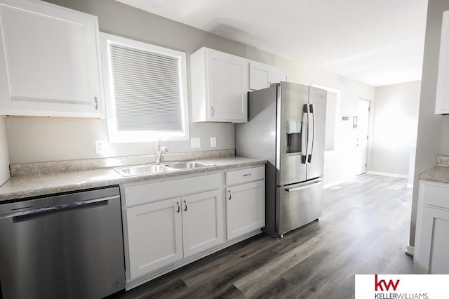 56420 708th Rd, Fairbury, NE 68352 - kitchen with stainless steel appliances, white cabinets, a sink, and dark wood-style flooring