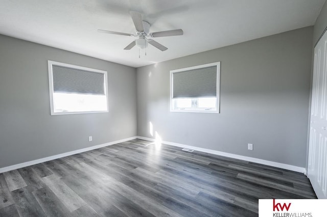 56420 708th Rd, Fairbury, NE 68352 - spare room featuring a ceiling fan, dark wood finished floors, and baseboards