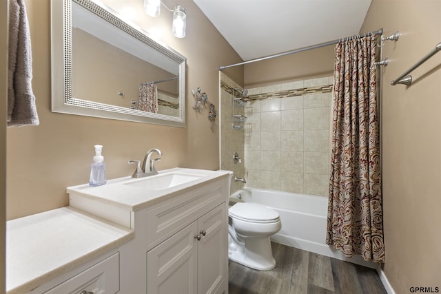 bathroom featuring shower / bath combo, wood finished floors, vanity, and toilet