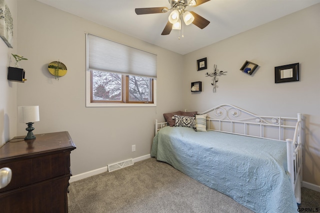 carpeted bedroom featuring baseboards and ceiling fan