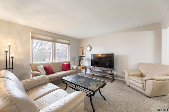 carpeted living room with baseboards