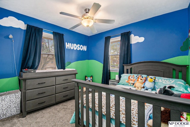 carpeted bedroom featuring ceiling fan