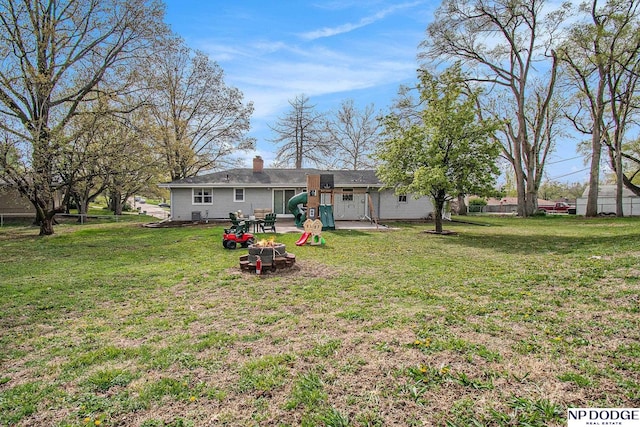 rear view of house featuring a chimney and a patio area