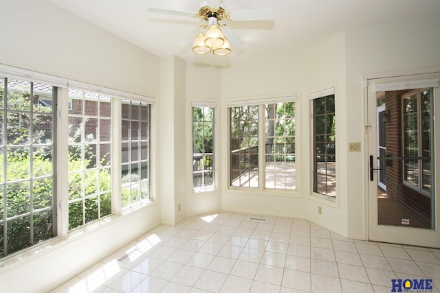 6427 Lone Tree Dr, Lincoln, NE 68512 - unfurnished sunroom featuring tile patterned flooring and baseboards