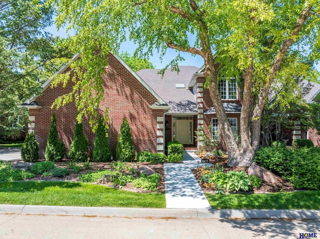 6427 Lone Tree Dr, Lincoln, NE 68512 - view of front facade with brick siding and a shingled roof