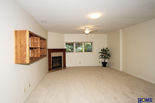 6427 Lone Tree Dr, Lincoln, NE 68512 - unfurnished living room with carpet, ceiling fan, a fireplace with flush hearth, and baseboards