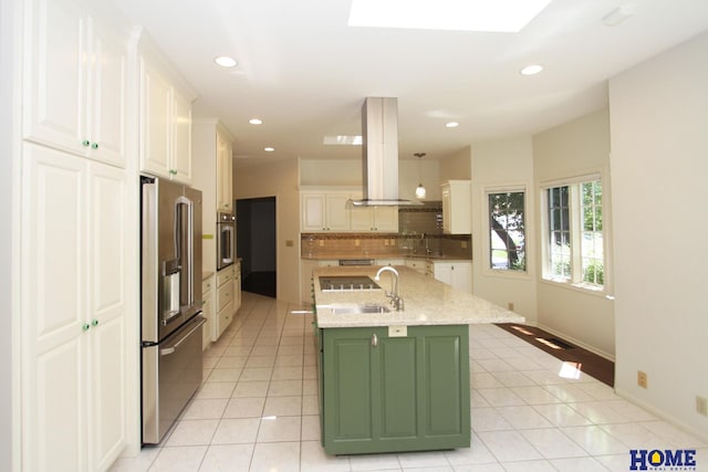6427 Lone Tree Dr, Lincoln, NE 68512 - kitchen with stainless steel appliances, island range hood, a sink, light tile patterned flooring, and recessed lighting