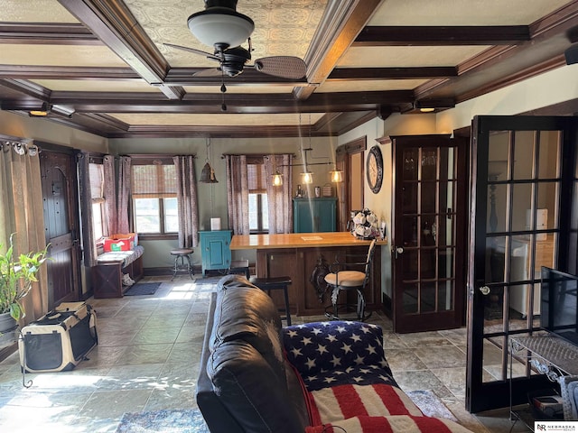 1244 N Elm St, Wahoo, NE 68066 - living area featuring coffered ceiling, crown molding, ceiling fan, beamed ceiling, and stone finish floors