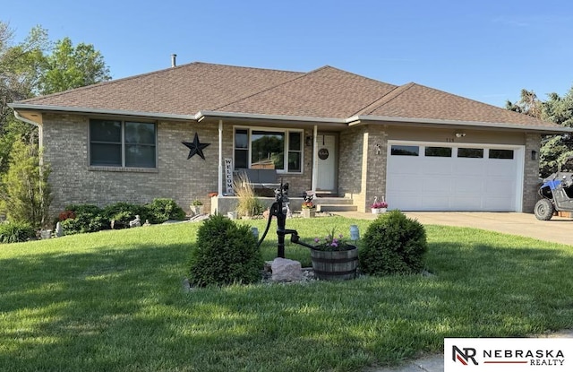 719 Cory Dr, Seward, NE 68434 - view of front facade with a garage, a front lawn, concrete driveway, brick siding, and roof with shingles