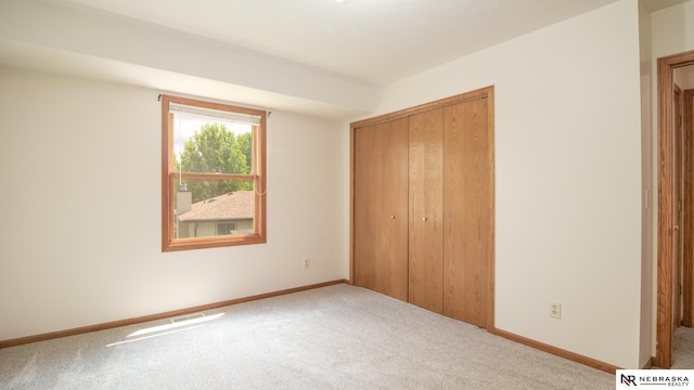 719 Cory Dr, Seward, NE 68434 - unfurnished bedroom with carpet, a closet, and baseboards