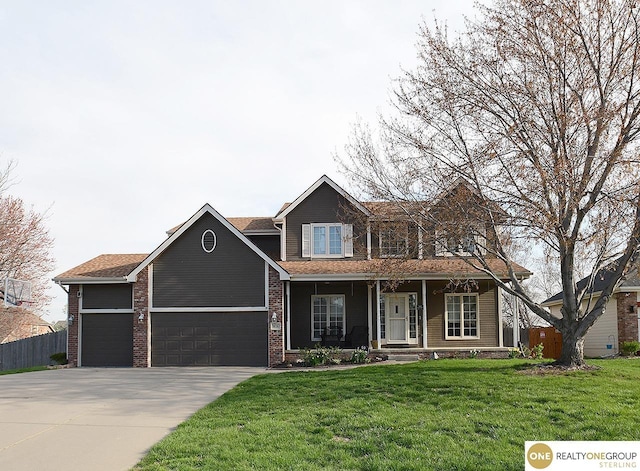 view of front of house featuring an attached garage, concrete driveway, covered porch, and brick siding