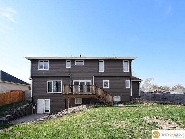 rear view of property featuring stairs and a deck