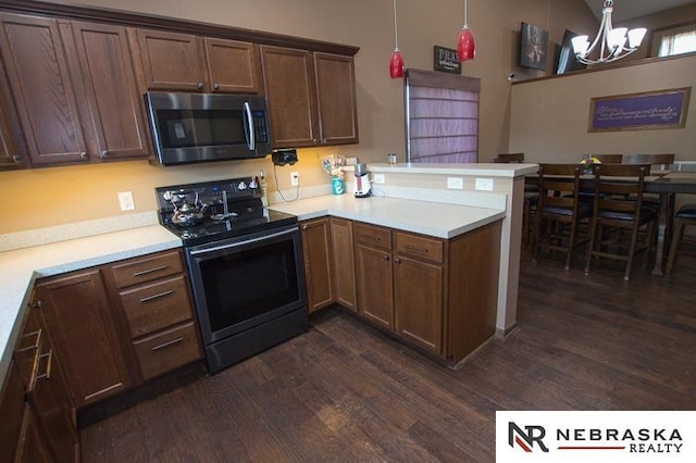 14311 Oldfield St, Waverly, NE 68462 - kitchen featuring stainless steel microwave, black / electric stove, a peninsula, a chandelier, and dark wood-style floors