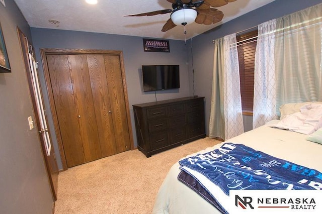 14311 Oldfield St, Waverly, NE 68462 - bedroom with light colored carpet, a closet, and a ceiling fan