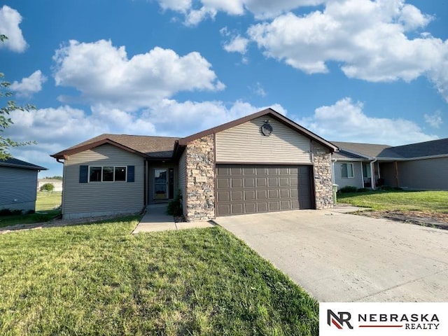 14311 Oldfield St, Waverly, NE 68462 - ranch-style home featuring a garage, a front lawn, concrete driveway, and stone siding