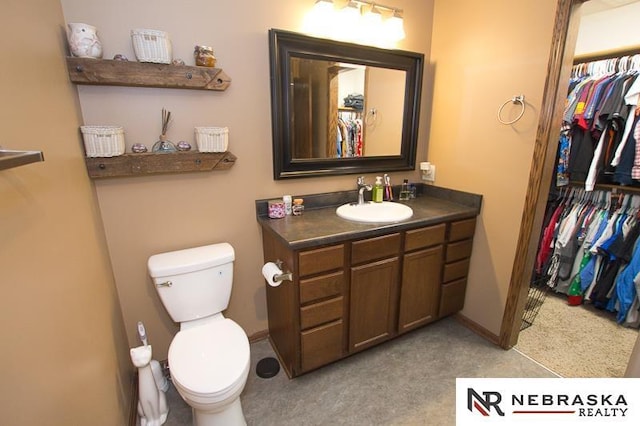 14311 Oldfield St, Waverly, NE 68462 - bathroom featuring toilet, vanity, and a spacious closet