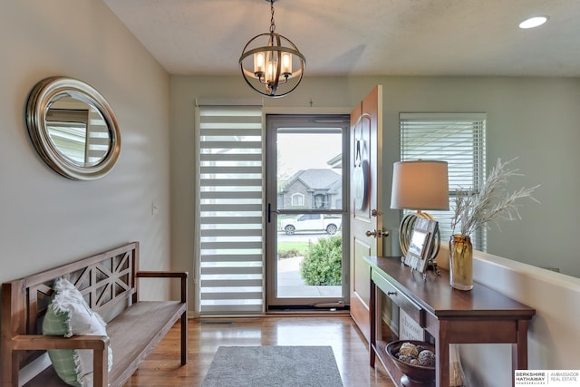 16315 Craig Ave, Bennington, NE 68007 - doorway to outside with wood finished floors and a chandelier