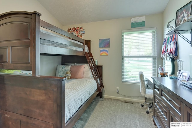 16315 Craig Ave, Bennington, NE 68007 - bedroom with light colored carpet, baseboards, a desk, and lofted ceiling