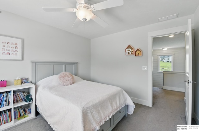bedroom with carpet flooring, baseboards, and a ceiling fan