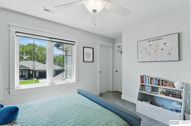 carpeted bedroom with baseboards and ceiling fan