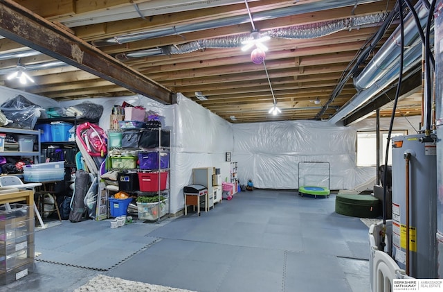 unfinished basement featuring water heater