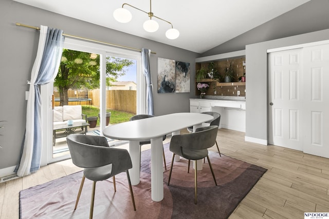 18667 R St, Omaha, NE 68135 - dining room with vaulted ceiling, light wood-style floors, and a desk