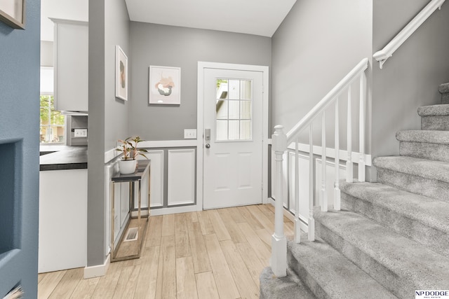 18667 R St, Omaha, NE 68135 - foyer with stairs and light wood finished floors