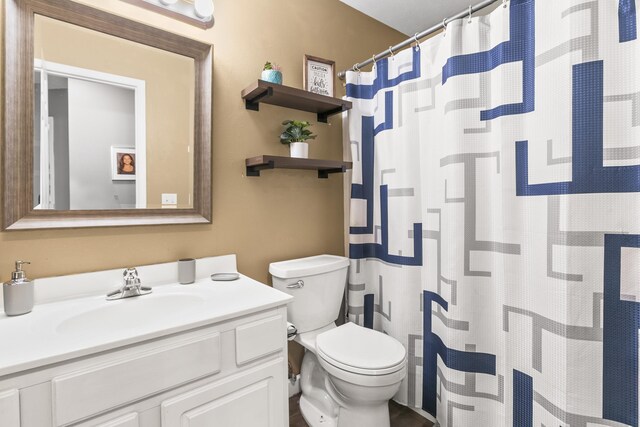 18667 R St, Omaha, NE 68135 - bathroom featuring toilet, vanity, and curtained shower