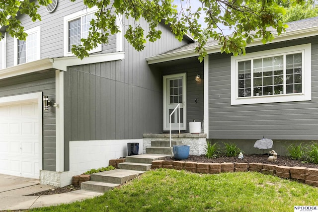 18667 R St, Omaha, NE 68135 - doorway to property with an attached garage