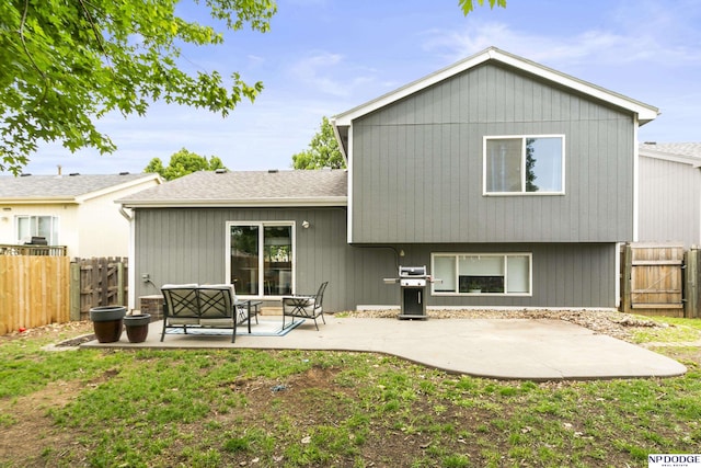18667 R St, Omaha, NE 68135 - back of house featuring a patio, a fenced backyard, a gate, and a shingled roof