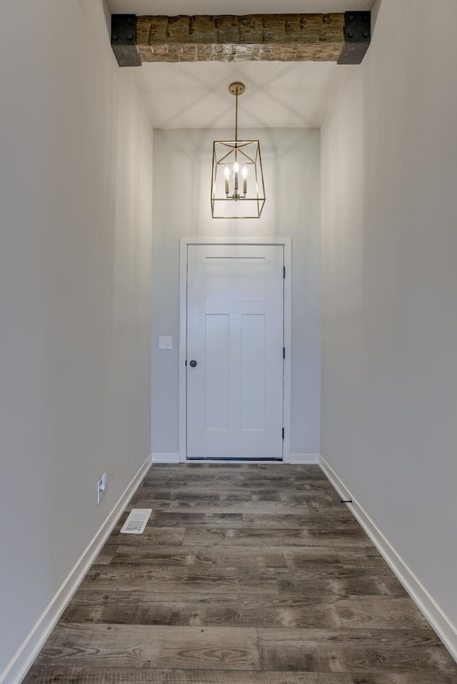 12618 Glenn St, Omaha, NE 68138 - doorway with a chandelier, dark wood-style floors, and baseboards