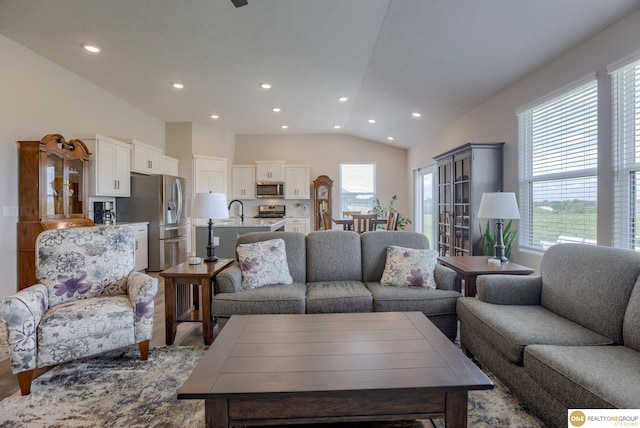 12618 Glenn St, Omaha, NE 68138 - living area with lofted ceiling, recessed lighting, and wood finished floors
