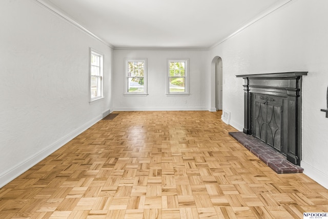 unfurnished living room with arched walkways, a fireplace, baseboards, and crown molding