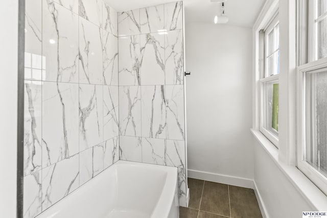 bathroom with tile patterned floors and baseboards