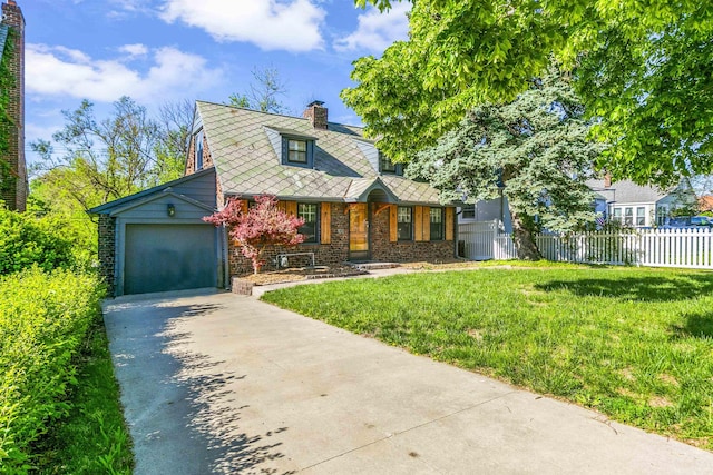 view of front of house featuring driveway, brick siding, a garage, and a chimney