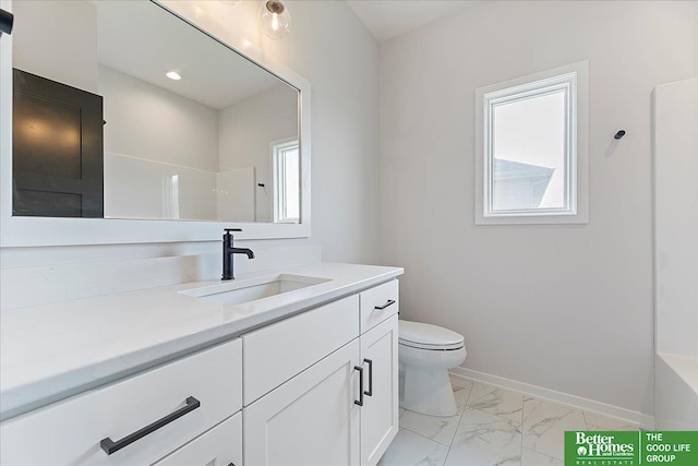 bathroom featuring marble look tile flooring, toilet, vanity, baseboards, and a shower