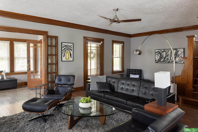 319 N 37th St, Omaha, NE 68131 - living area featuring a ceiling fan, crown molding, baseboards, a textured ceiling, and wood finished floors
